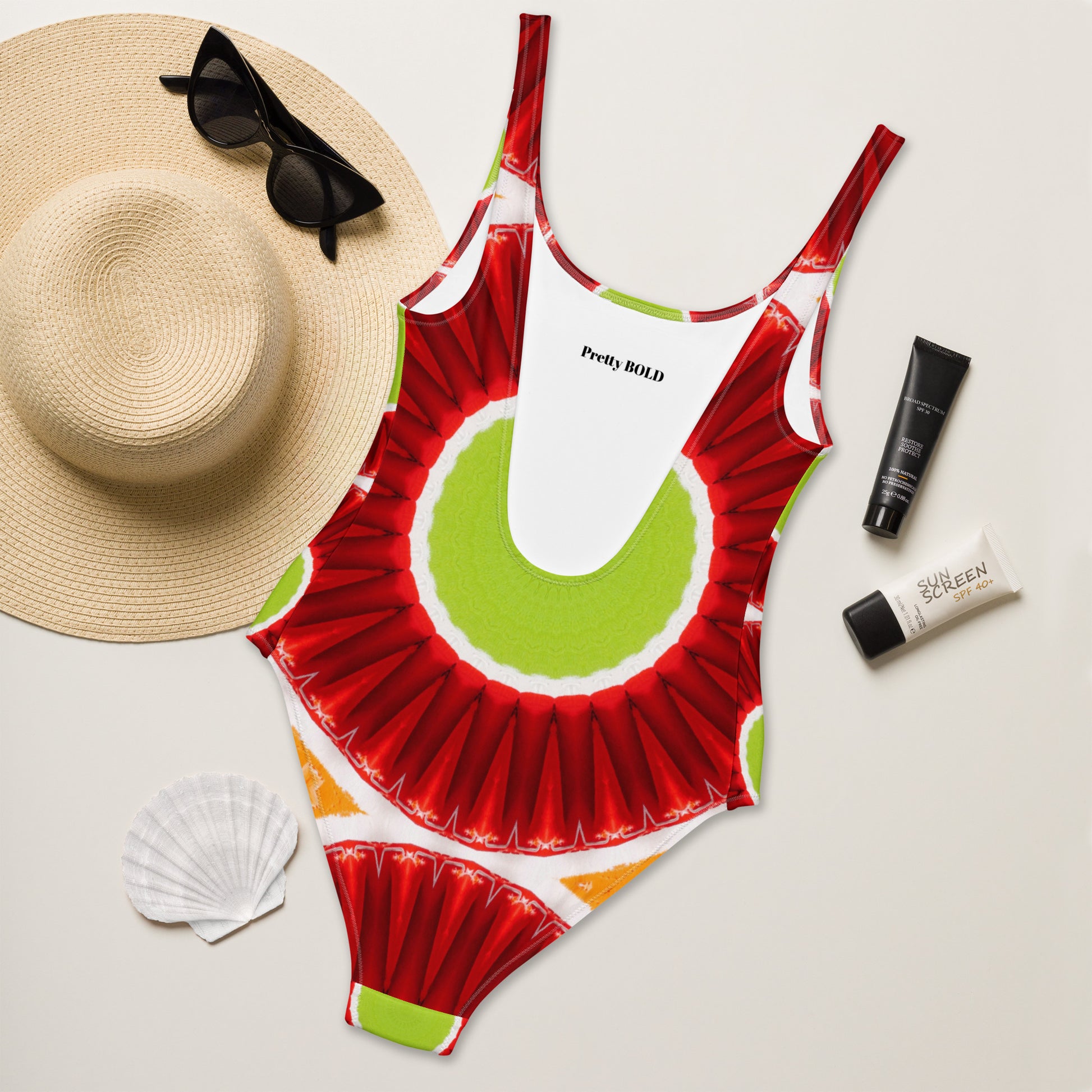 Bright circles green orange and red one-piece swimsuit, back view