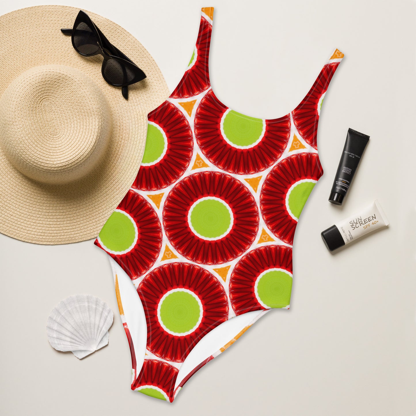 Bright circles green orange and red one-piece swimsuit, front view