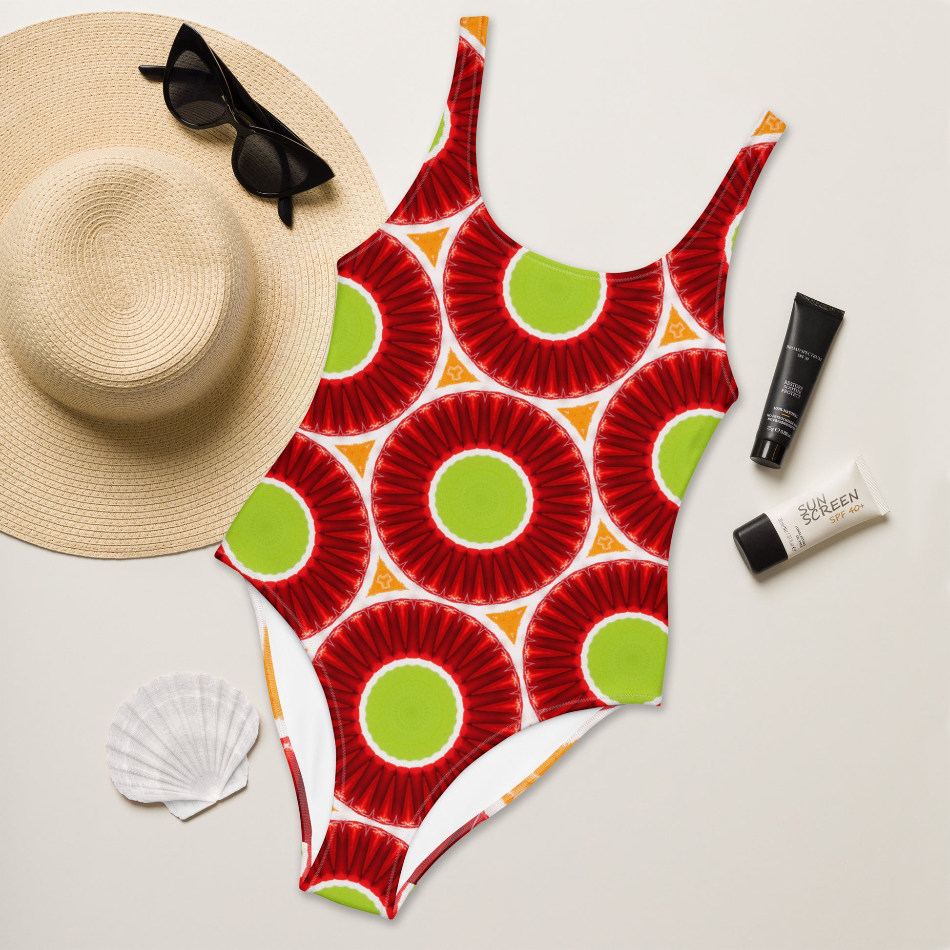 Bright circles green orange and red one-piece swimsuit, front view